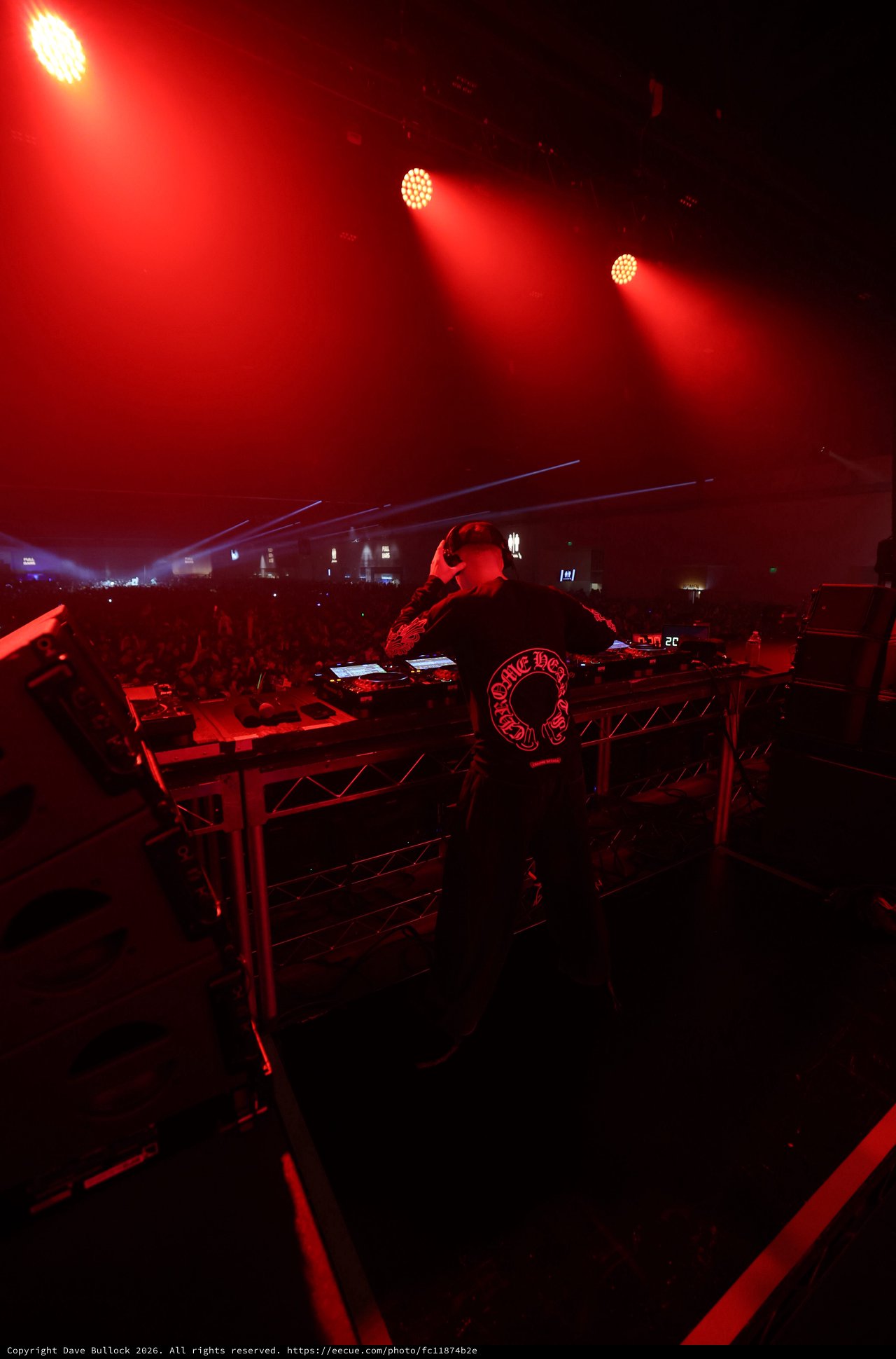 DJ Commands the Stage Under Crimson Festival Lights
