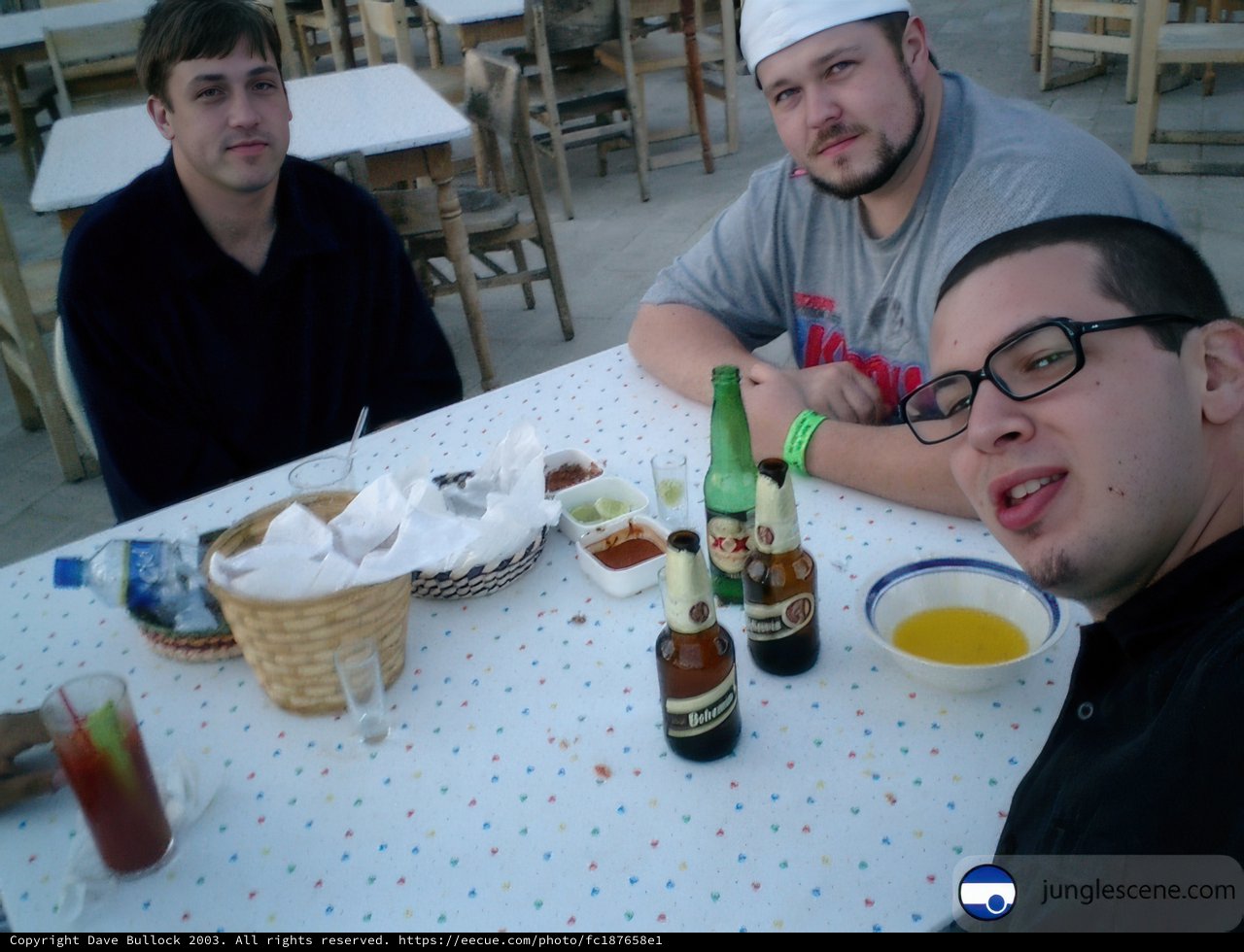 Three Men Enjoying a Beer at a Restaurant in 2003