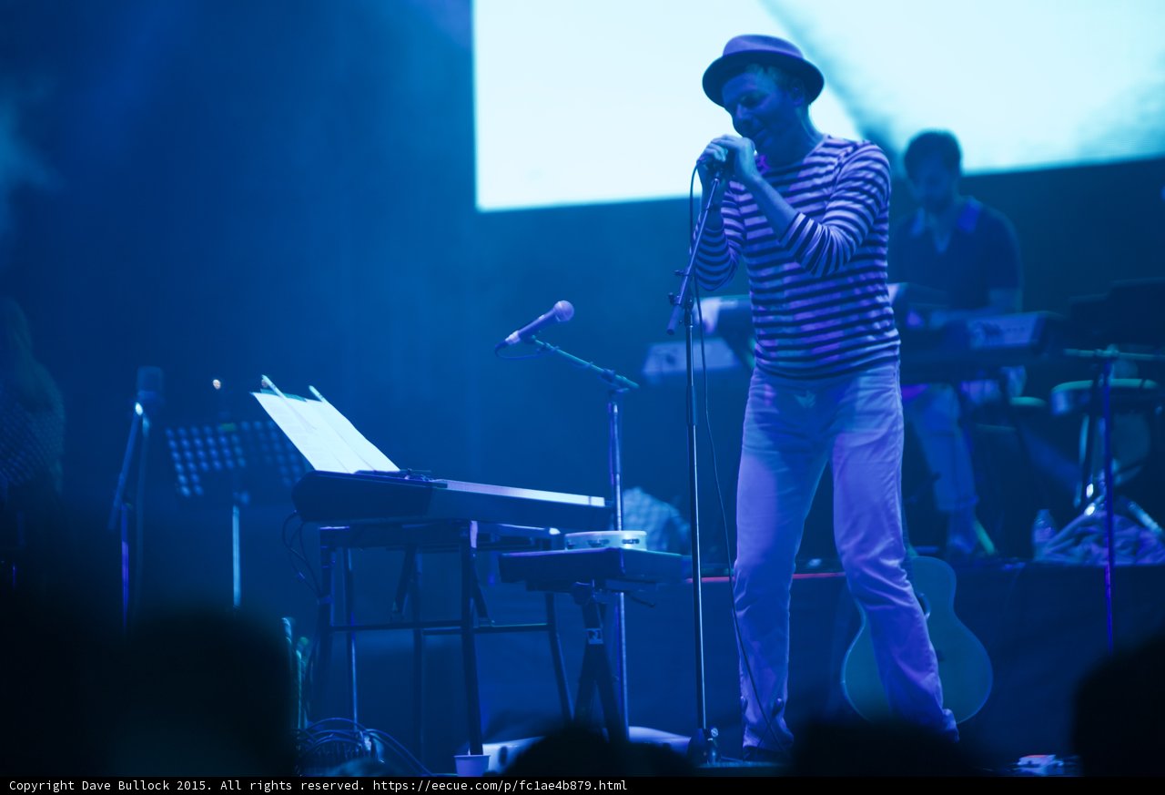 Belle and Sebastian Stuart Murdoch Singing Fedora Striped Shirt Full Stage Setup Band Blue