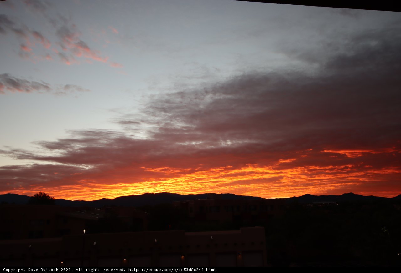 Fiery Sunset Over Mountain Ranges