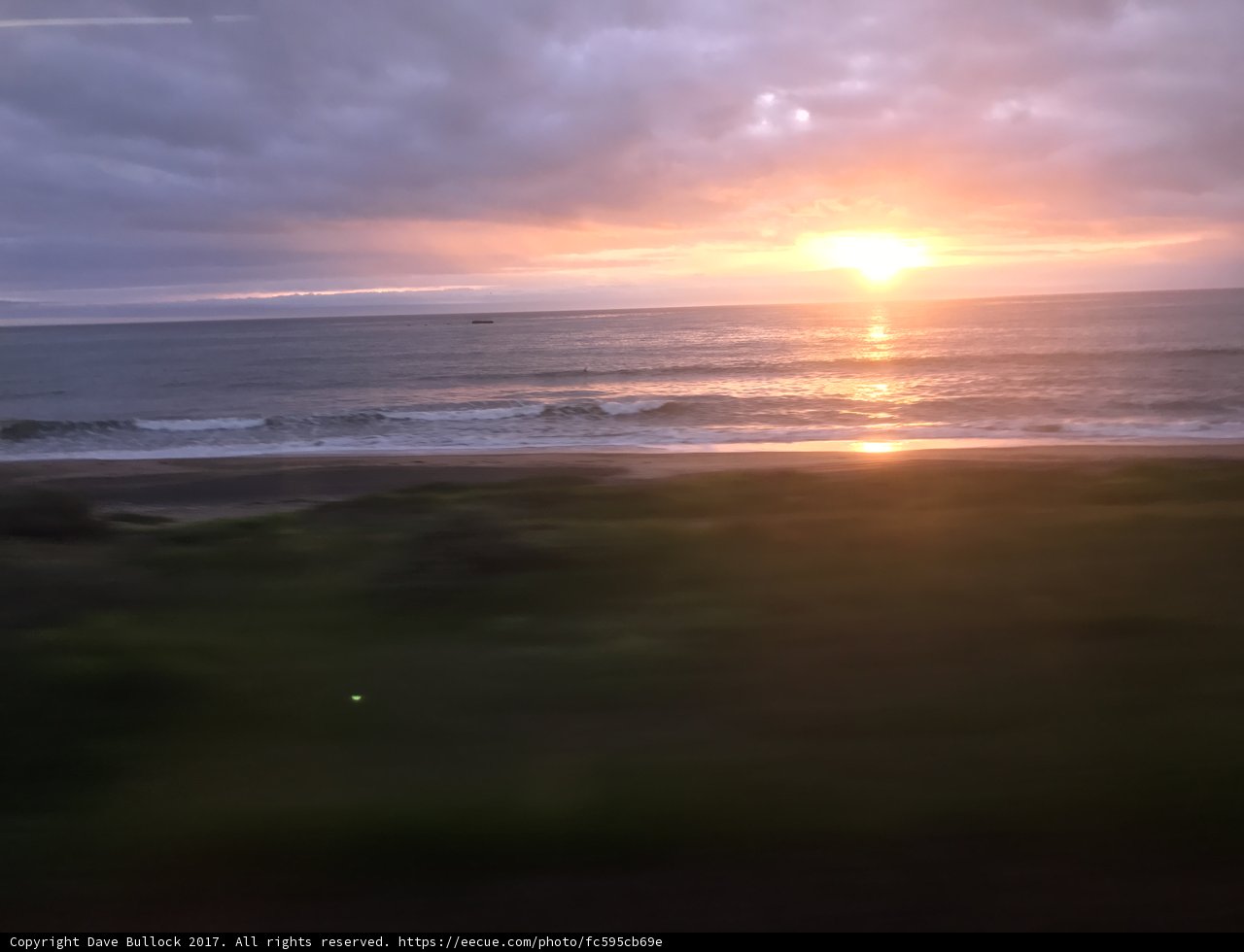 Golden Hour Flare Over the Pacific