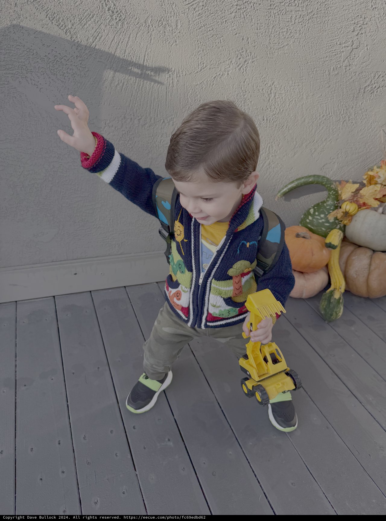 Toddler Playing with Yellow Toy Truck