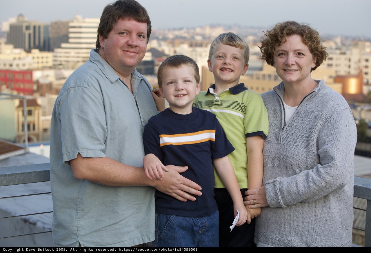 Family Portrait on Urban Rooftop at Dusk