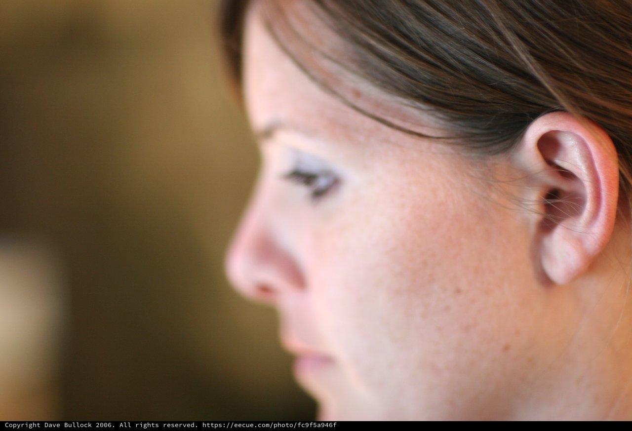 Pensive Profile of a Freckled Woman in Shallow Focus