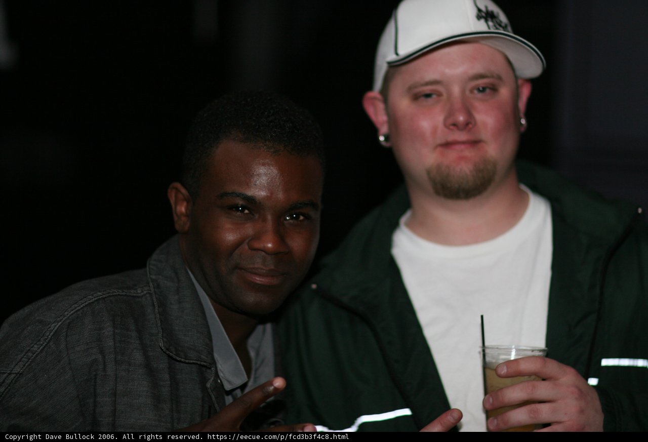 Two Men Sharing a Drink at Bass Rush Anniversary