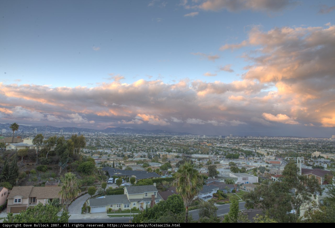 Cloudy Cityscape from Hillside View