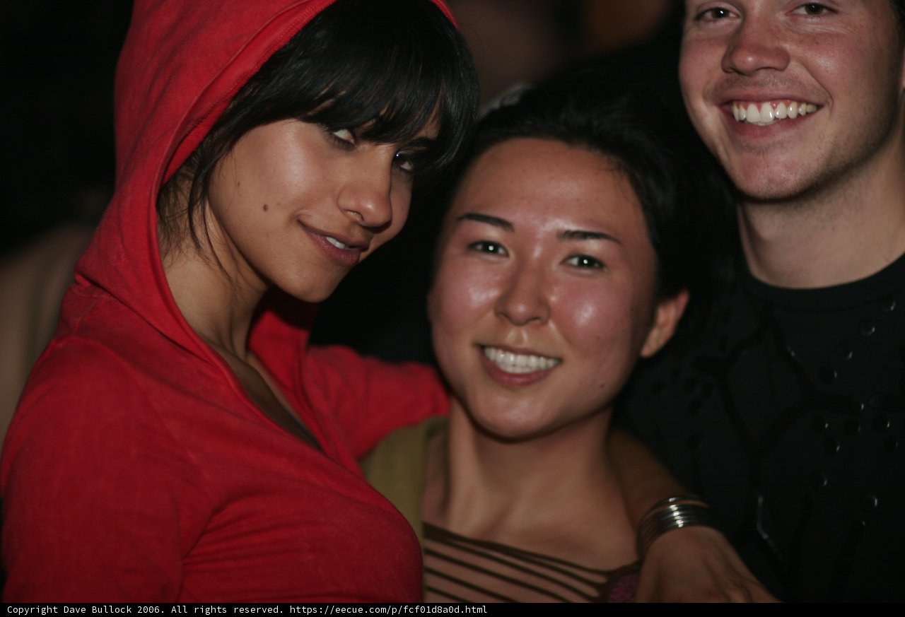 Partygoers share a joyful grin
