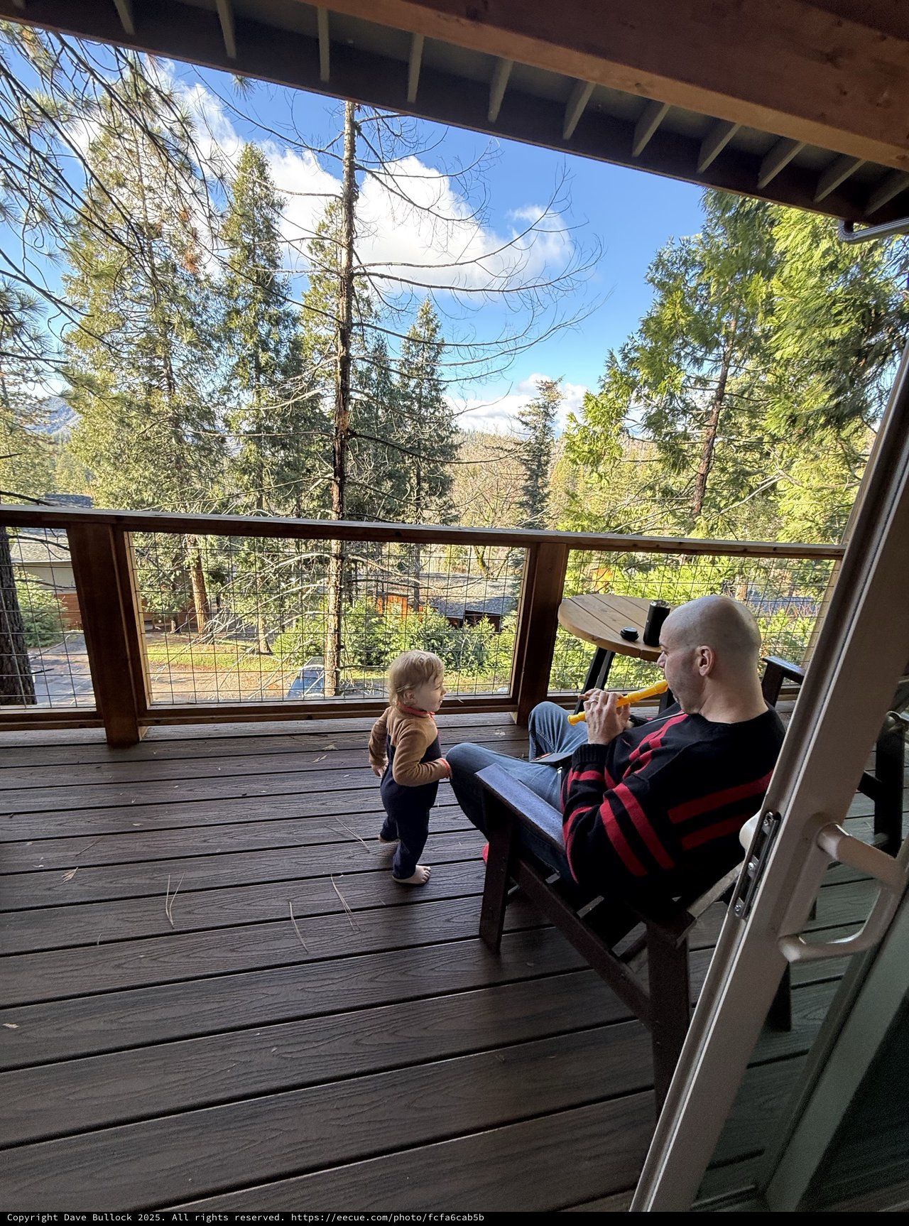 Father and Toddler Share Peaceful Deck Moment