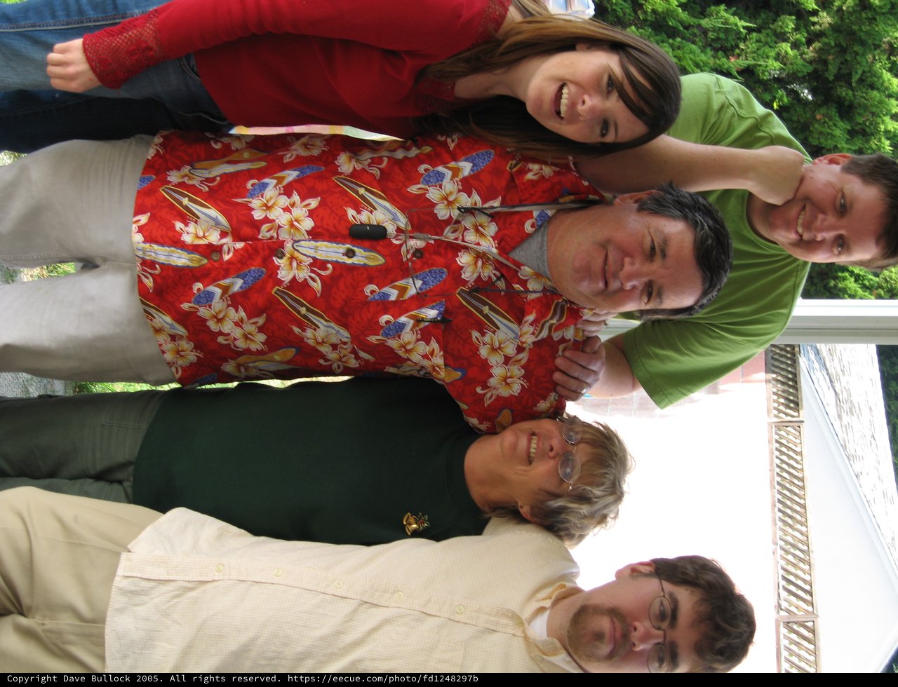 Five Family Members Celebrate Christmas Together Indoors
