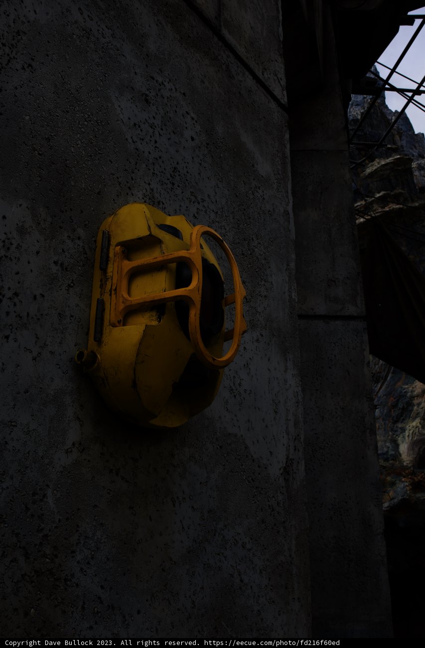 Yellow Hardhat on Building Wall