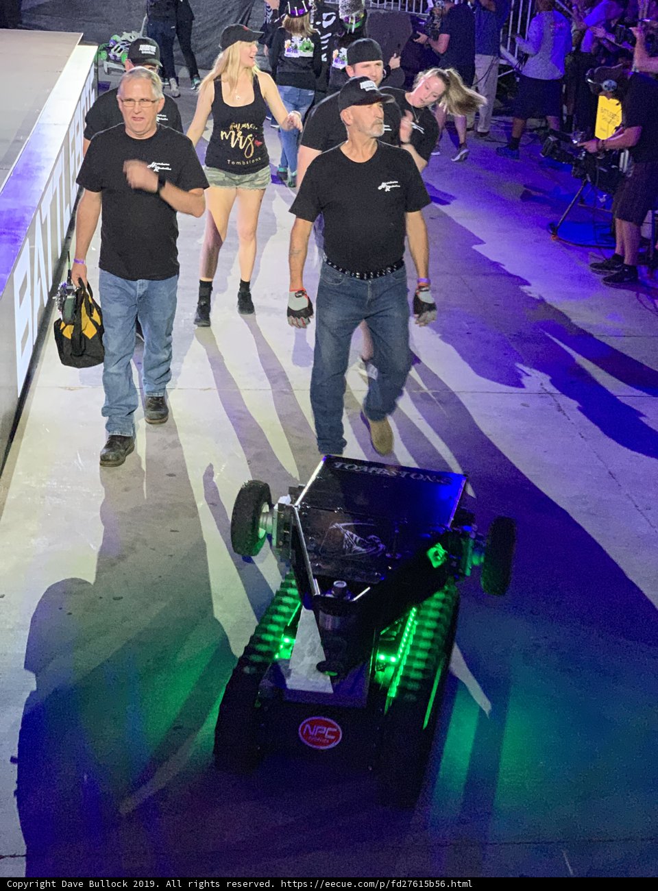 Man walks with robot on Las Vegas stage