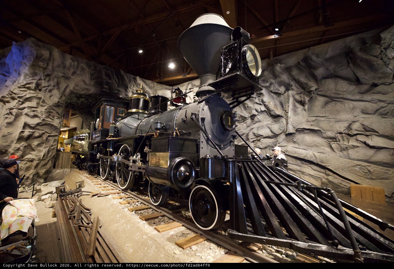 Historic Steam Locomotive Display in Cave-Like Museum Setting