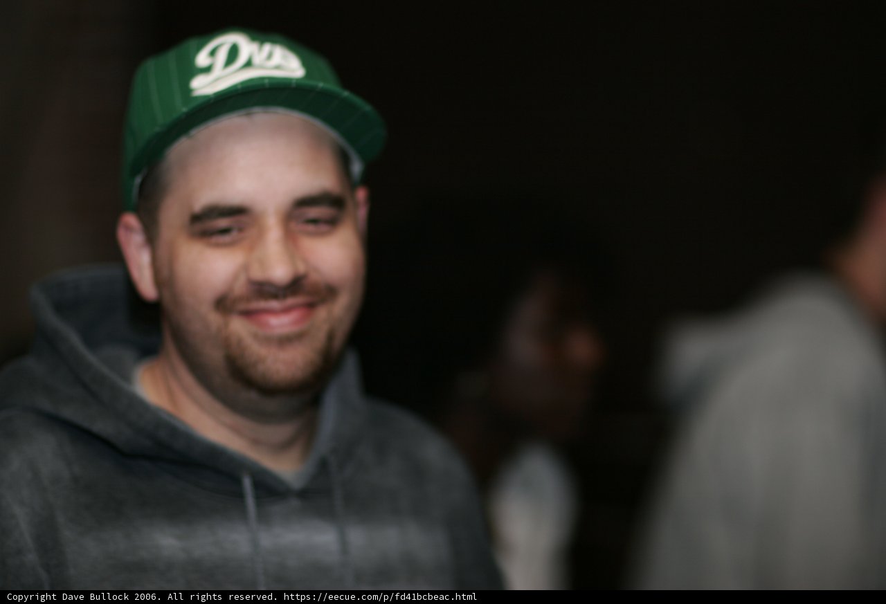 Green-Hatted Man with a Smile