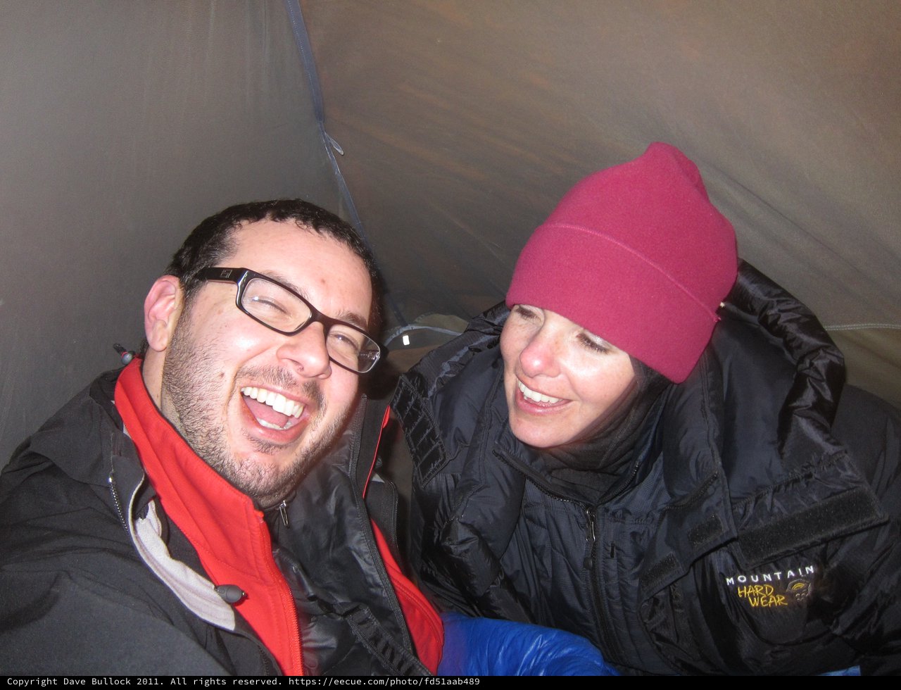 Laughing Friends Sharing Joy Inside a Tent