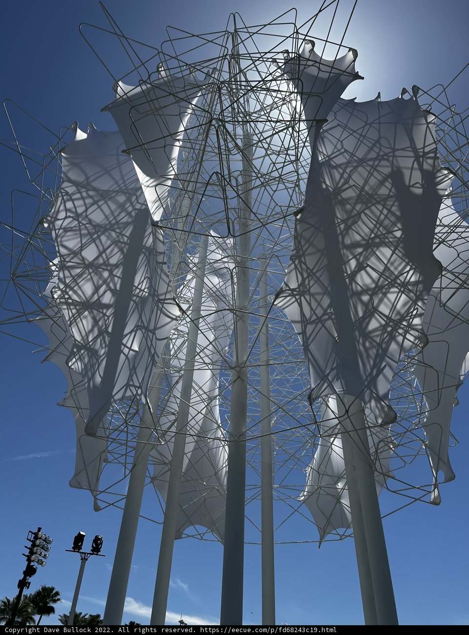 Towering Fabric Sculpture Against City Skyline