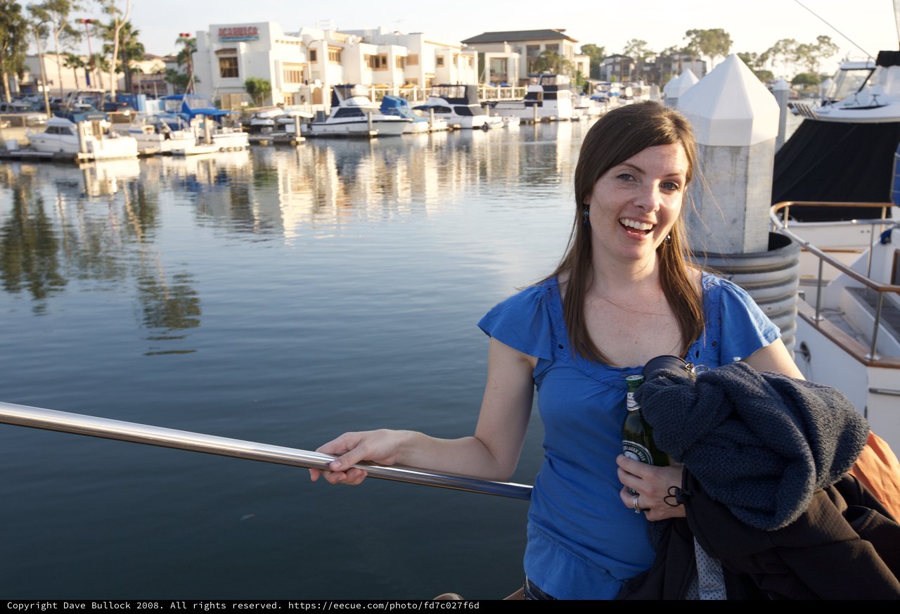 Woman Smiling at a California Marina at Sunset