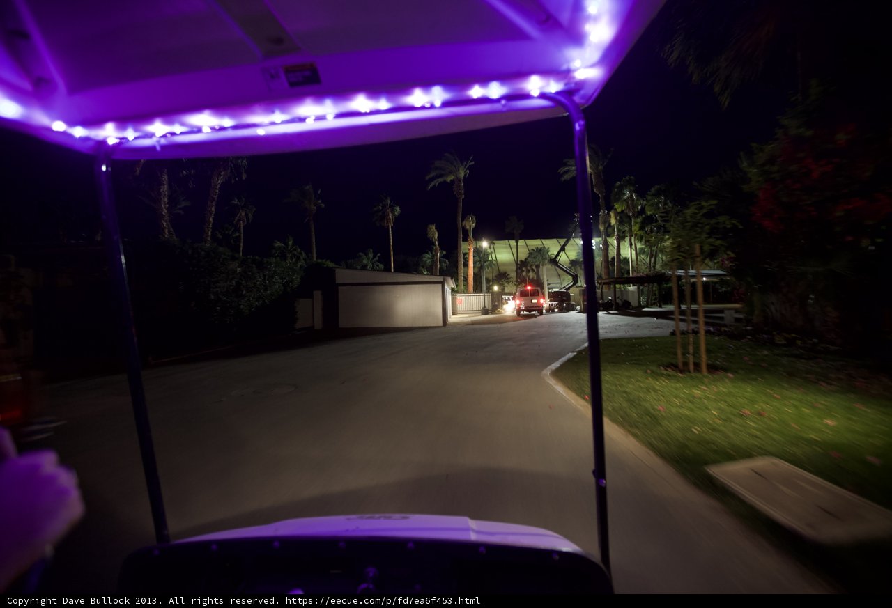 Purple-Lit Golf Cart on Tarmac