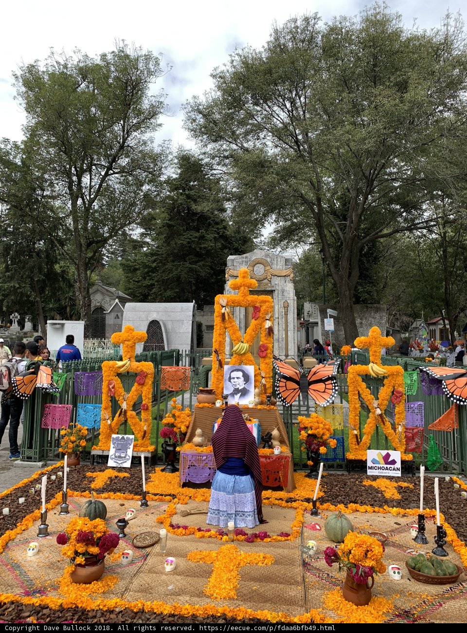 Woman Prays at Decorated Altar