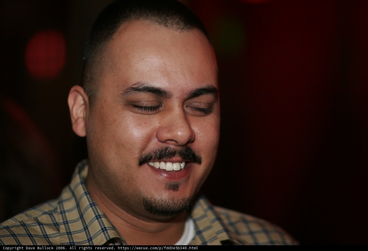 The Smiling Mustachioed Man