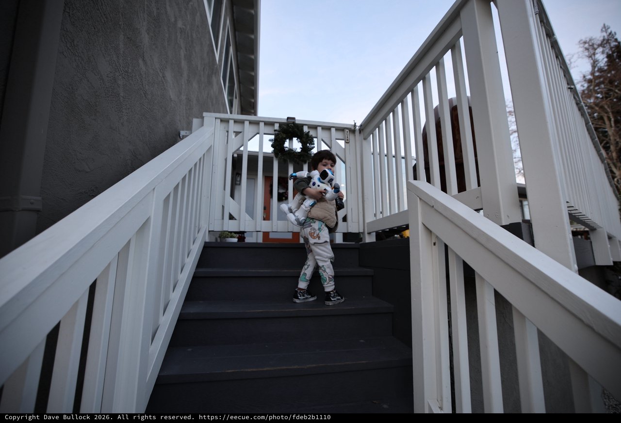 Children Embracing on Outdoor Stairway at Dusk