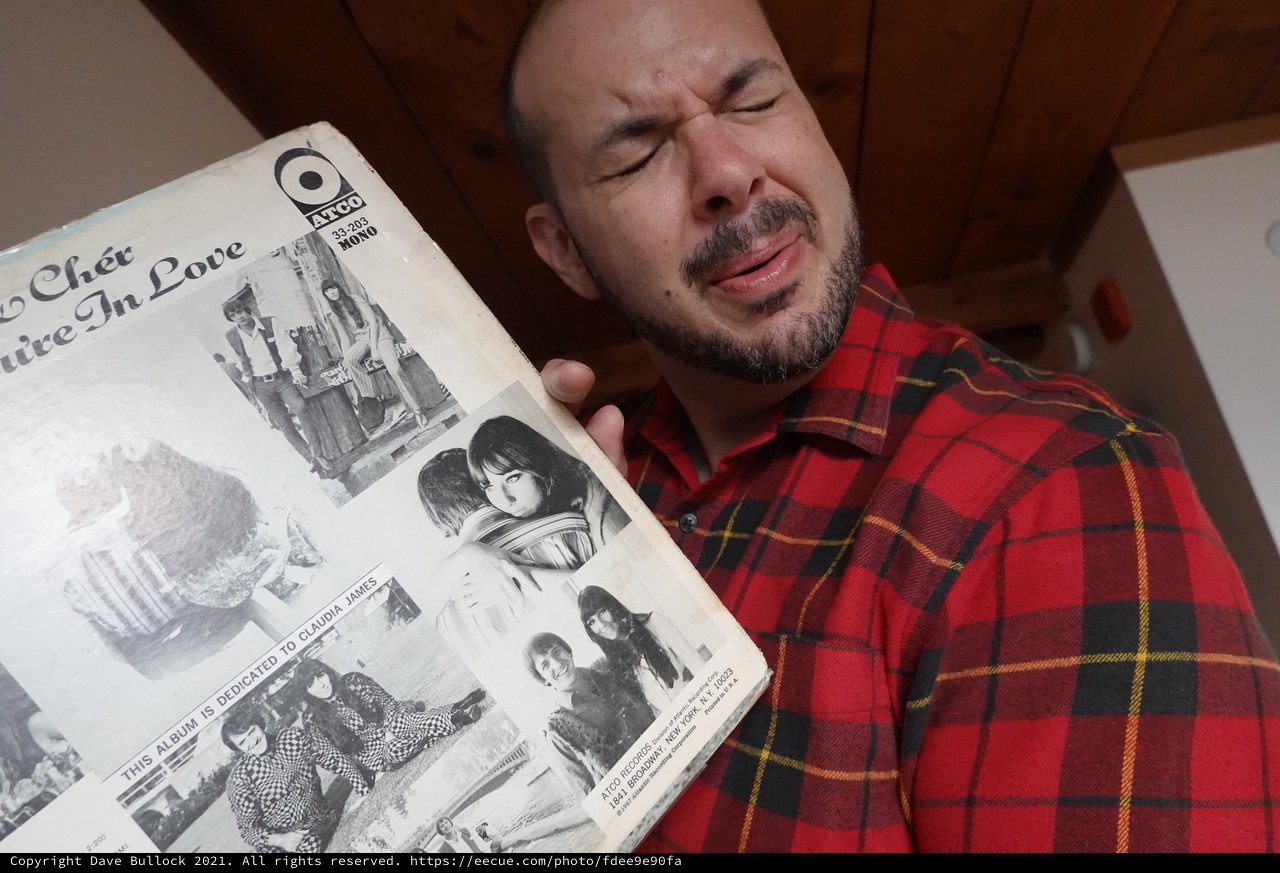 Man Reading Vintage Music Magazine in Flannel