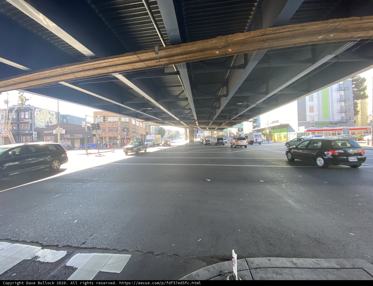 Cars Pass Underneath an Urban Overpass