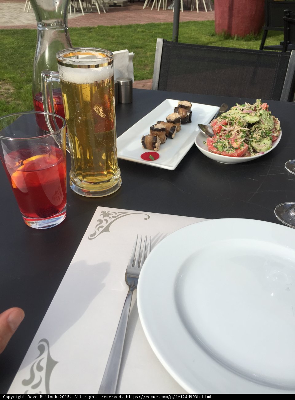 White plate with beer and cutlery
