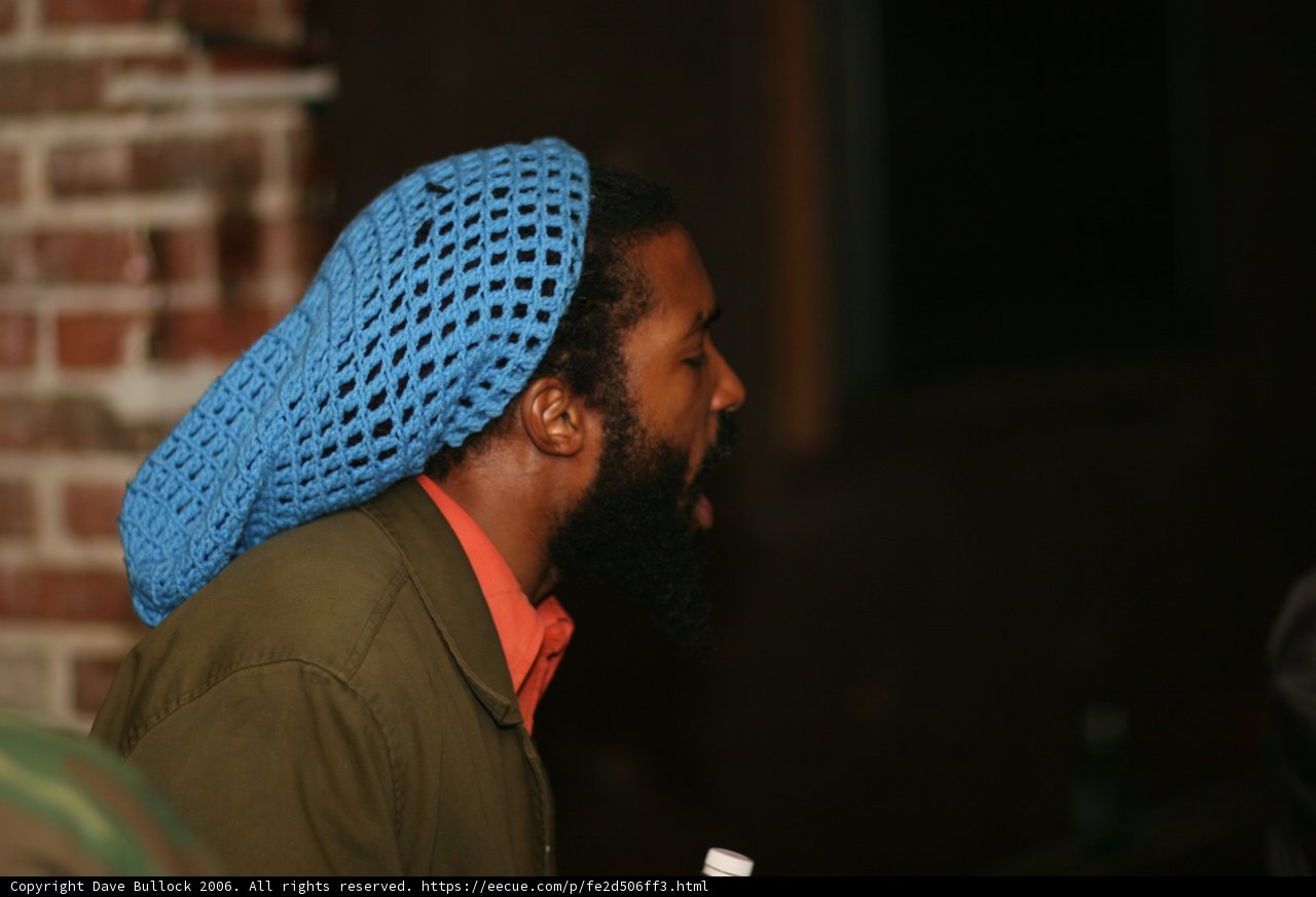 Singing Man with Blue Beanie and Beard