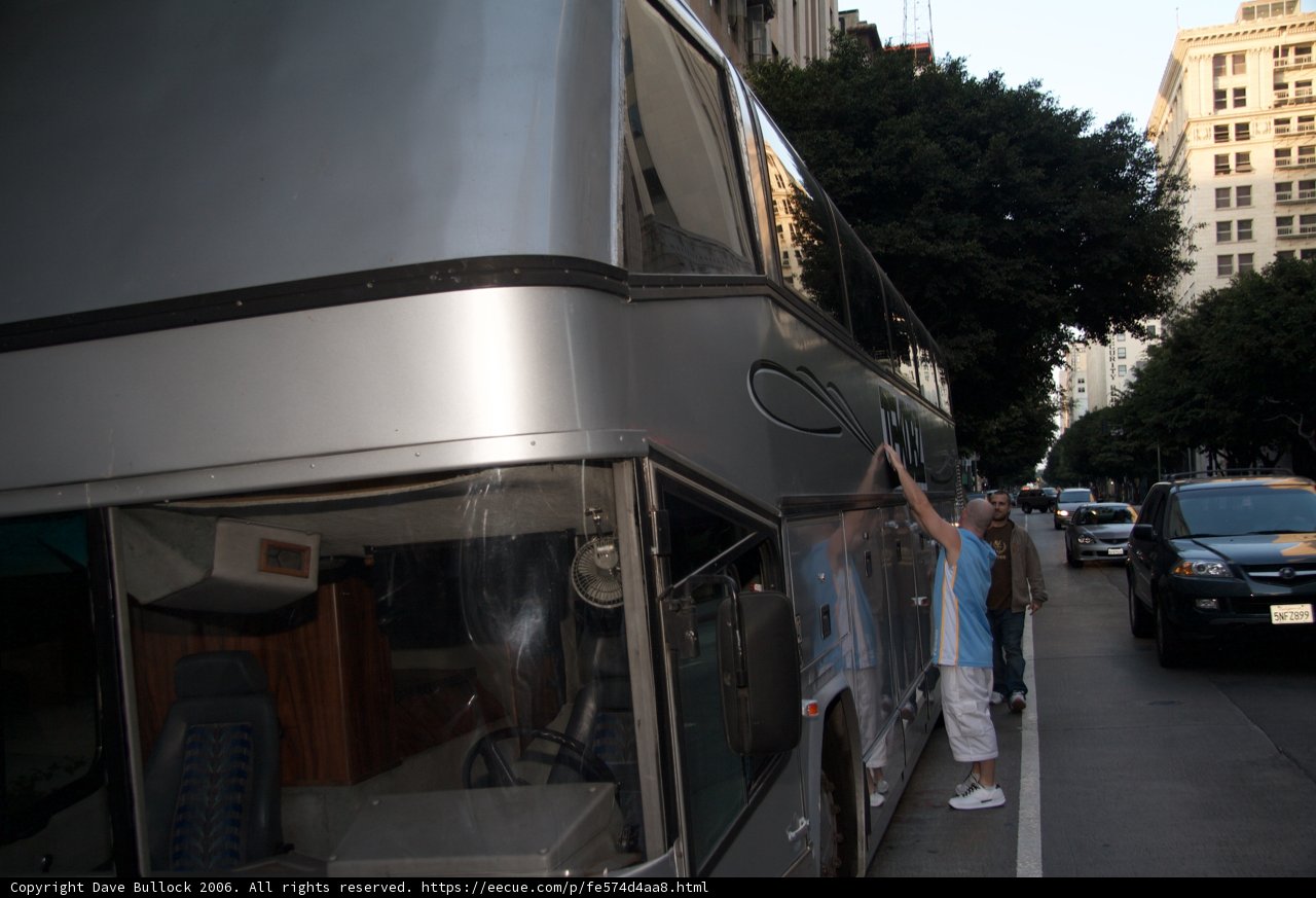 Silver Tour Bus on the Road