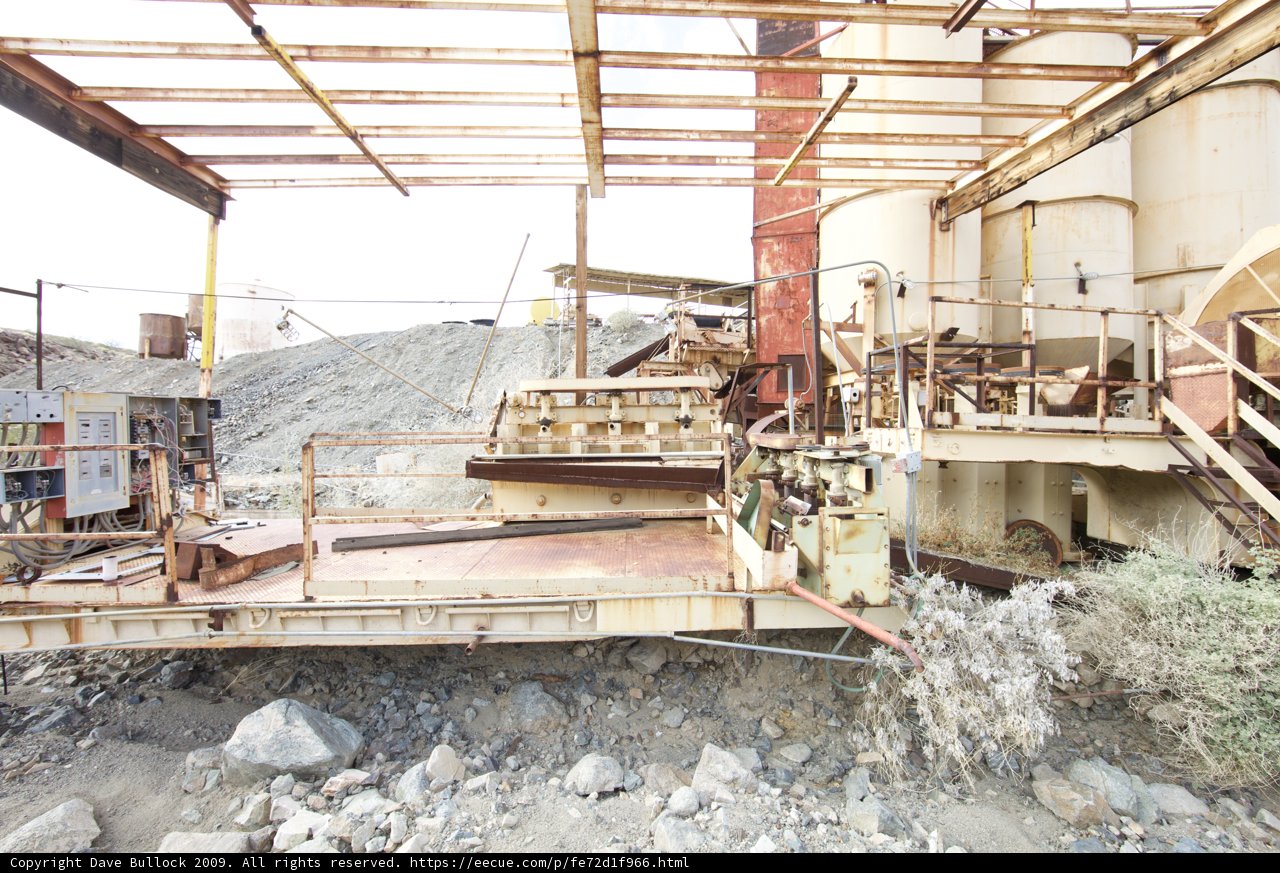 Industrial Giant Amidst Rocky Terrain
