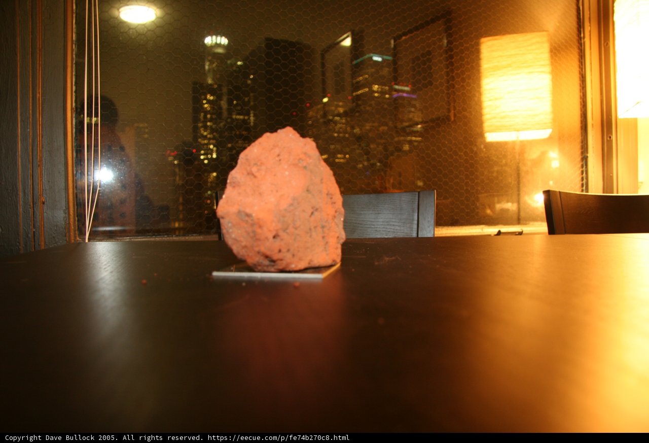 The Rock on the Wooden Table by the Window