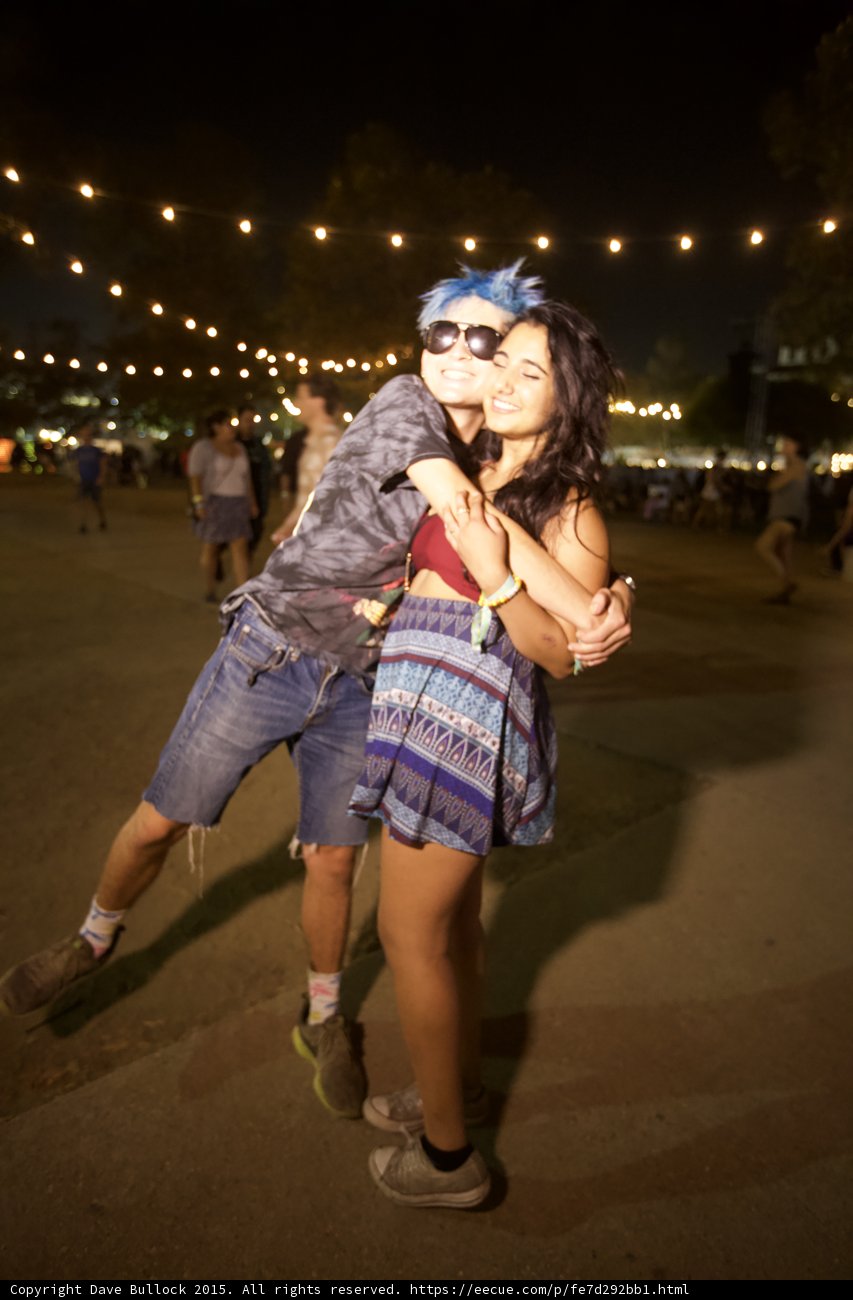 Couple Embracing Under String Lights