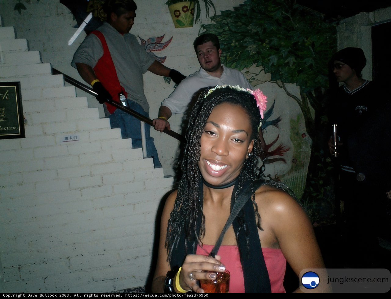 Dreadlocked Woman Enjoying Her Drink