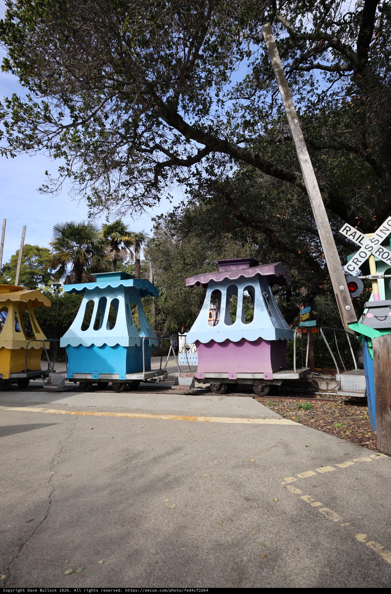 Colorful Miniature Train Stations at Railroad Crossing