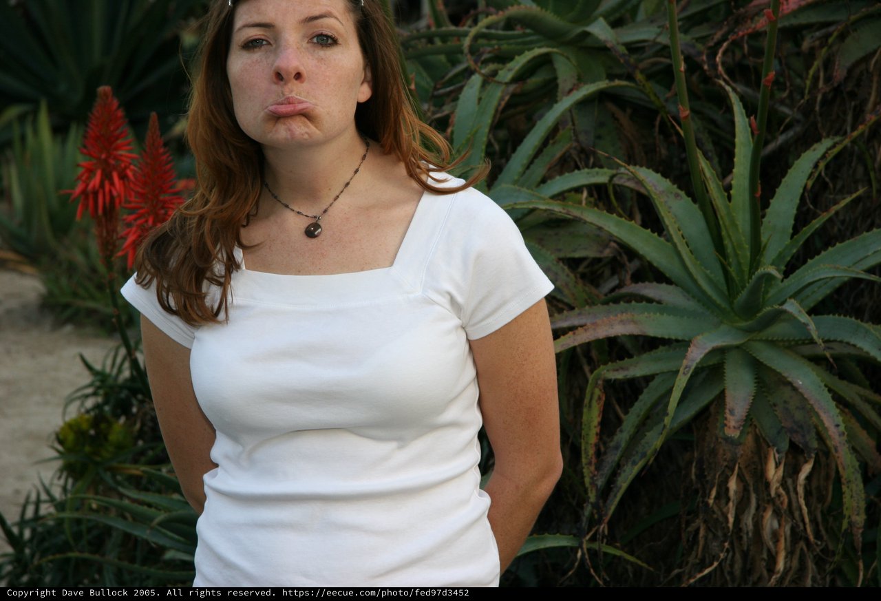 Young Woman Making Pouty Face in Desert Garden