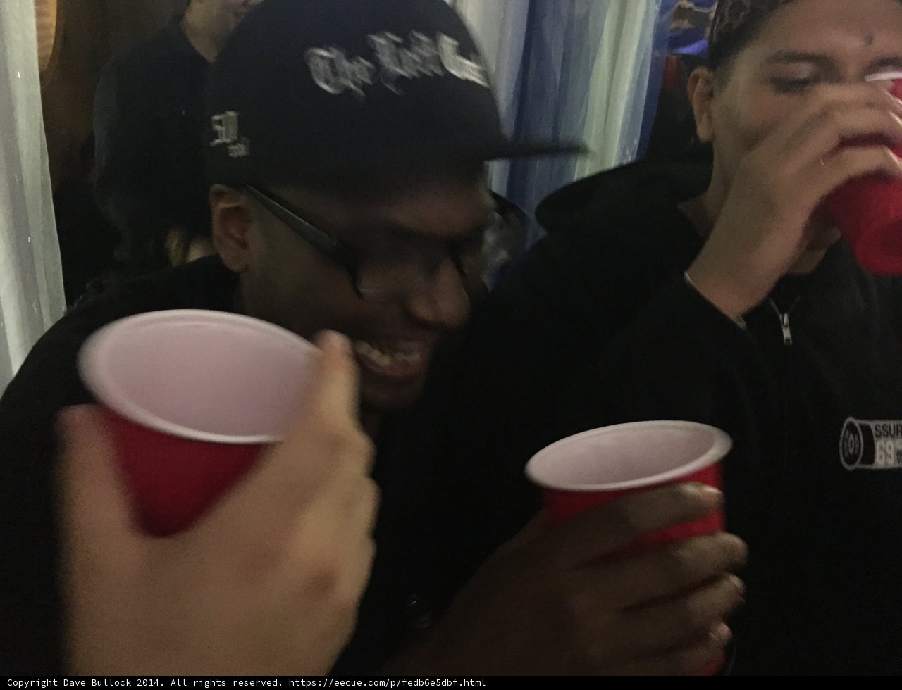 Two Men Clink Cups