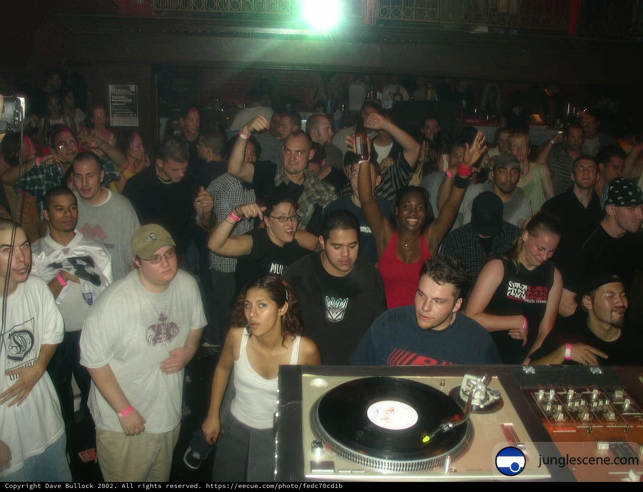 Nightclub Crowd Enjoys DJ Performance