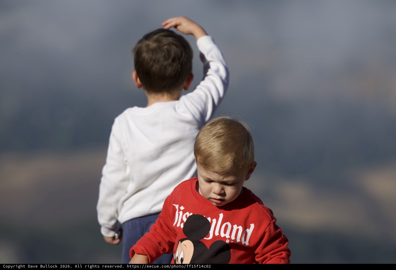Two Young Boys Against a Stormy Sky
