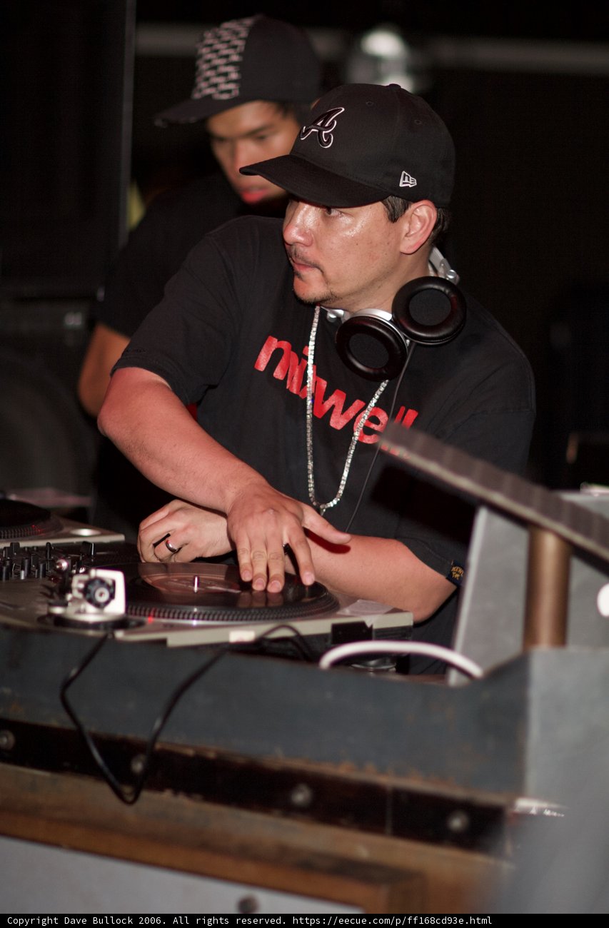 Man in Black Shirt Entertaining with Turntable