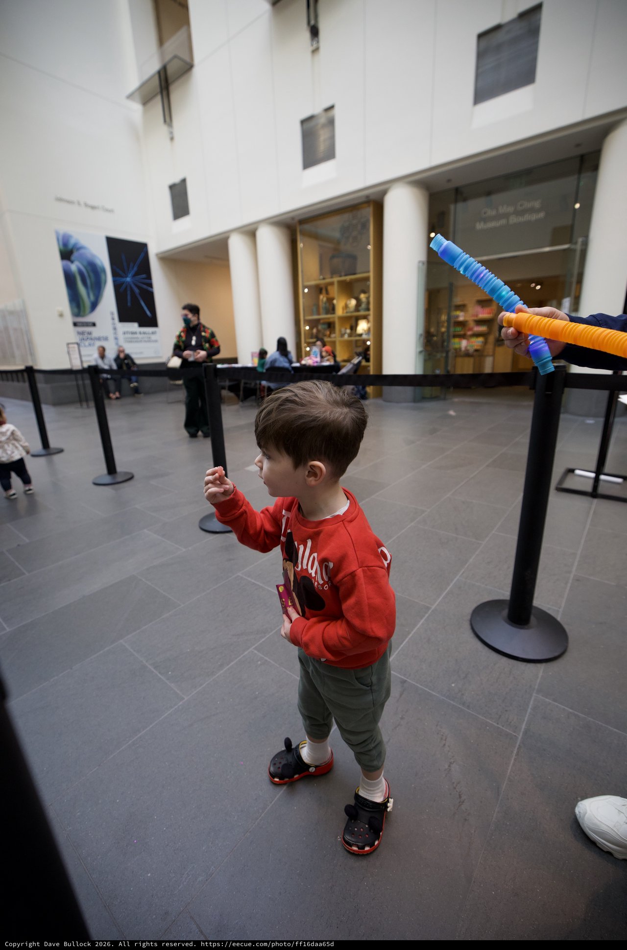 Child Playing with Foam Sword at Asian Art Museum