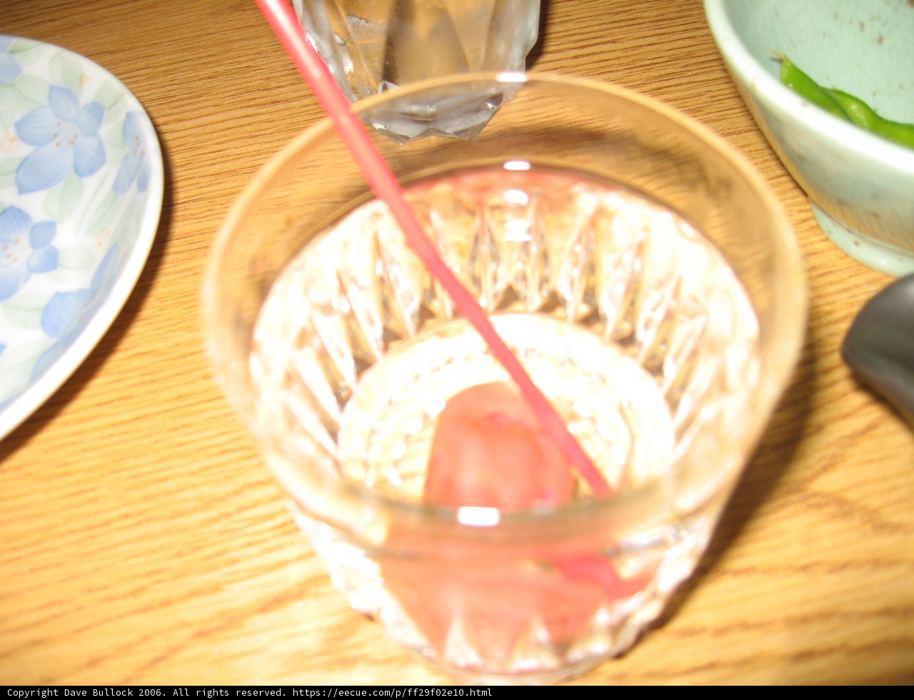 Refreshing Cocktail in a Glass with Straw