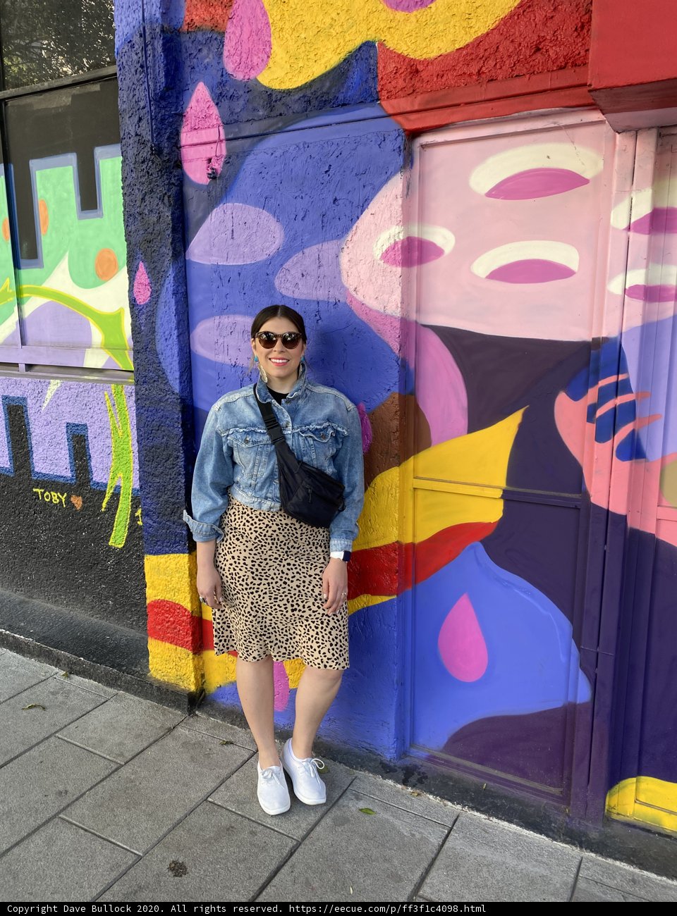 Standing Bold in Front of Graffiti Wall