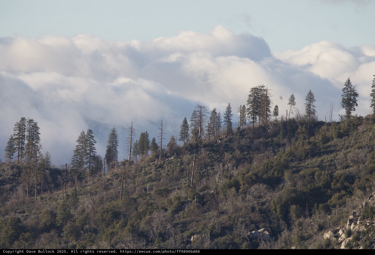 Mountain Ridge Through Smoke and Clouds Above Yosemite