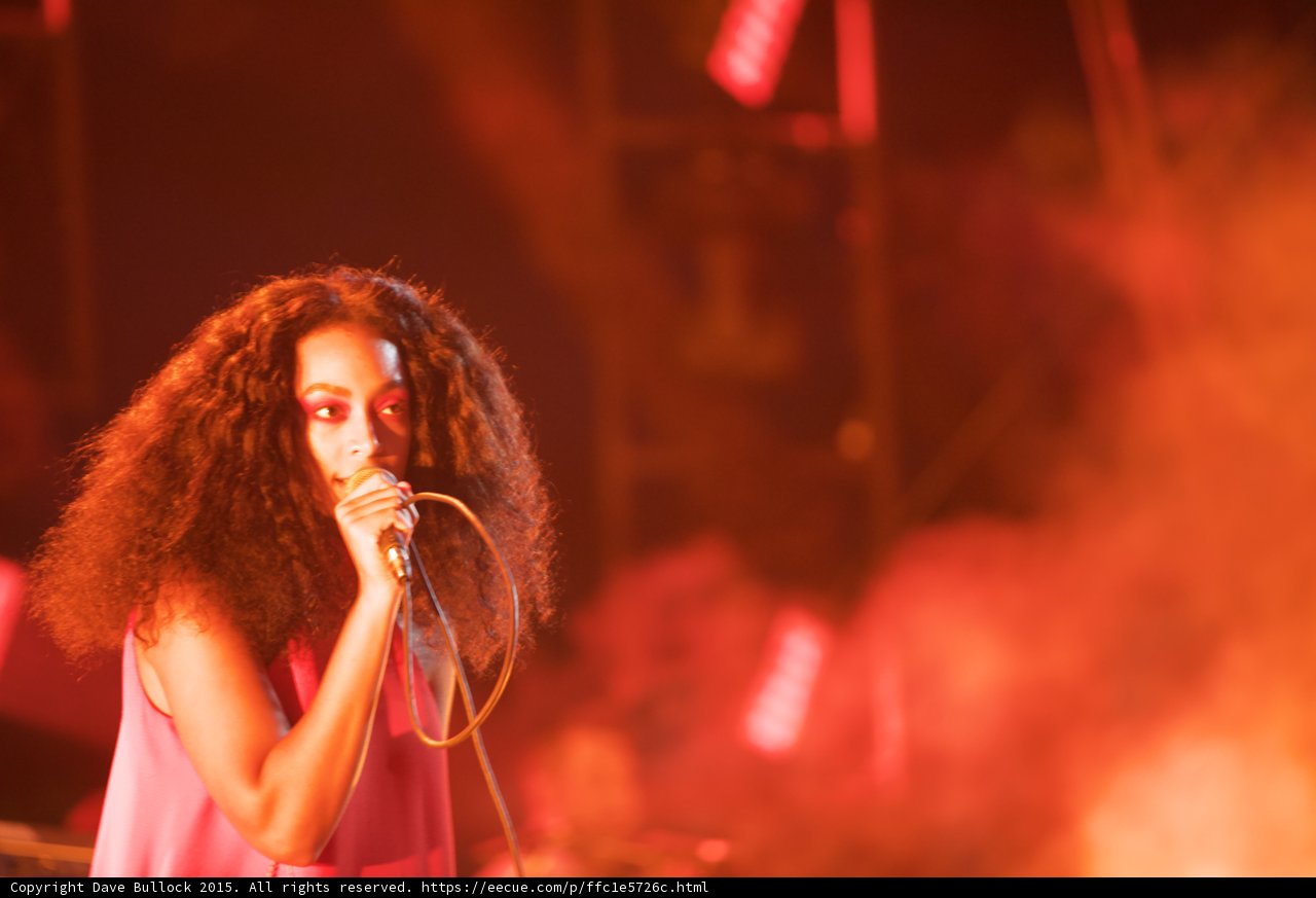 Solange Portrait Singing Band Member Background Red Orange