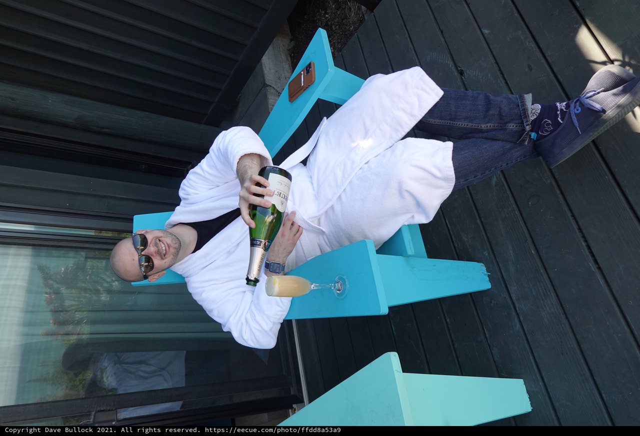 Relaxing with Champagne in White Bathrobe