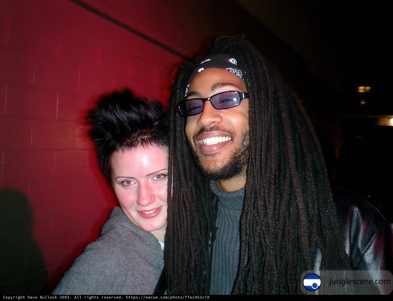 Urban Portrait with Smiling Couple and Dreadlocked Man