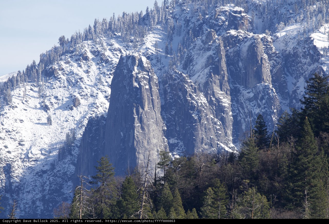 Winter's Majesty: Snow-Covered Granite Cliffs in Yosemite