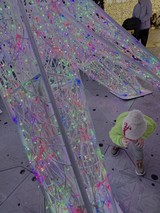 Child Explores Colorful Interactive Light Installation
