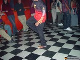 Red-shirted man getting his groove on at a nightclub