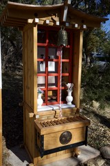 Traditional Japanese Shinto Shrine with Bell and Offerings